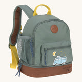 The Lassig kids mini adventure backpack in a green colour with a brown base, and a little camper van design on the front zip pocket.