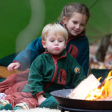 Child sat at a campfire wearing an olive green polar fleece zipped fleece from Little Green Radicals, made from recycled polar fleece, for sale at Babipur.