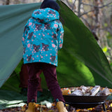 Back of girl stood in a forest wearing a Kids Warm Waterproof, 5000MM rating, Winter Hooded School Coat in Winter Rabbits print, by Little Green Radicals, made from recycled bottles and a cosy polyester fleece, buy now at Babipur.