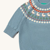 A close up of the Little Green Radicals fairisle knitted jumper in little ducks available at Babipur showing the fairisle design and elasticated cuff detail.