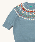 A close up of the Little Green Radicals fairisle knitted jumper in little ducks available at Babipur showing the fairisle design and elasticated cuff detail.