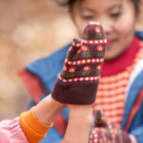 Close up of a child's hand wearing a knitted brown and red floral mitten from the Little Green Radicals Autumn Winter 2025 range - made from GOTS organic and Fairtrade certified cotton, available now at Babipur.