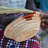 A look at the hand making process of weaving the copper wire to create a part of the bowl