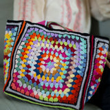 A close up view of the MADE51 Jedda Handmade Crochet Tote Bag, showing all the bold colours