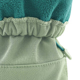A close up of the Mamalila  baby allrounder winter booties in mint green available at Babipur showing the toggle detail and fleece inner