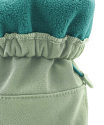 A close up of the Mamalila  baby allrounder winter booties in mint green available at Babipur showing the toggle detail and fleece inner