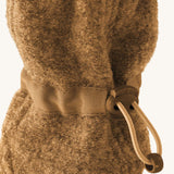 Mamalila Baby Wool Booties - in camel brown. Baby booties made from upcycled boiled wool available at Babipur. Photo shows elastic pull string ankle fastening