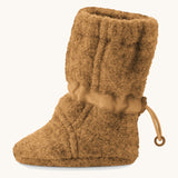 Side image of a Mamalila Baby Wool Booties - in camel brown. Baby booties made from upcycled boiled wool and available at Babipur.