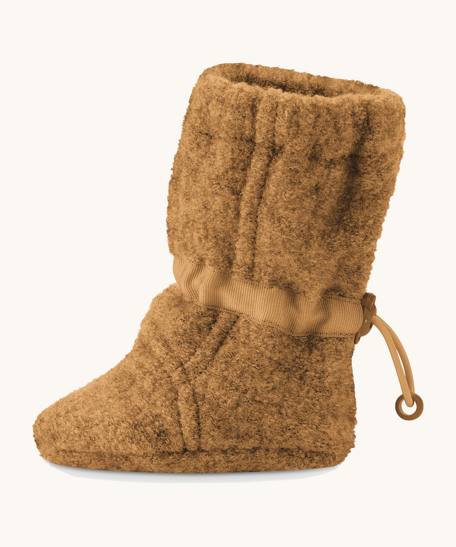 Side image of a Mamalila Baby Wool Booties - in camel brown. Baby booties made from upcycled boiled wool and available at Babipur.