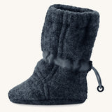 Side image of a Mamalila Baby Wool Booties - in navy blue. Baby booties made from upcycled boiled wool and available at Babipur.