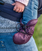 A close up of a baby wearing the Mamalila quilted Berlin booties in berry colour available at Babipur. Showing the toggle fastener detail