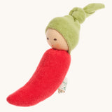 Nanchen Chilli Rattle Doll. An adorable hand crafted, soft rattle toy in the design of a red chili pepper, with a cute green hat with a knot on top. On a cream backgorund