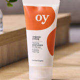 OY! Clear Skin Cleansing Moisturiser on a wooden table