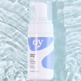 The OY Face Wash with a watery background