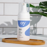 The OY Face wash on a wooden board