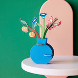 Studio Roof Dutch Masters inspired bouquet 3D pop out card decoration available at Babipur displayed on a white table against a green wall