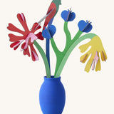 Studio roof small small paper bloom Matisse bouquet with  available at Babipur displayed in a blue vase