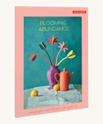 The pastel coloured cardboard packaging presenting the Studio Roof cardboard bouquet in blooming abundance colour way available at Babipur.