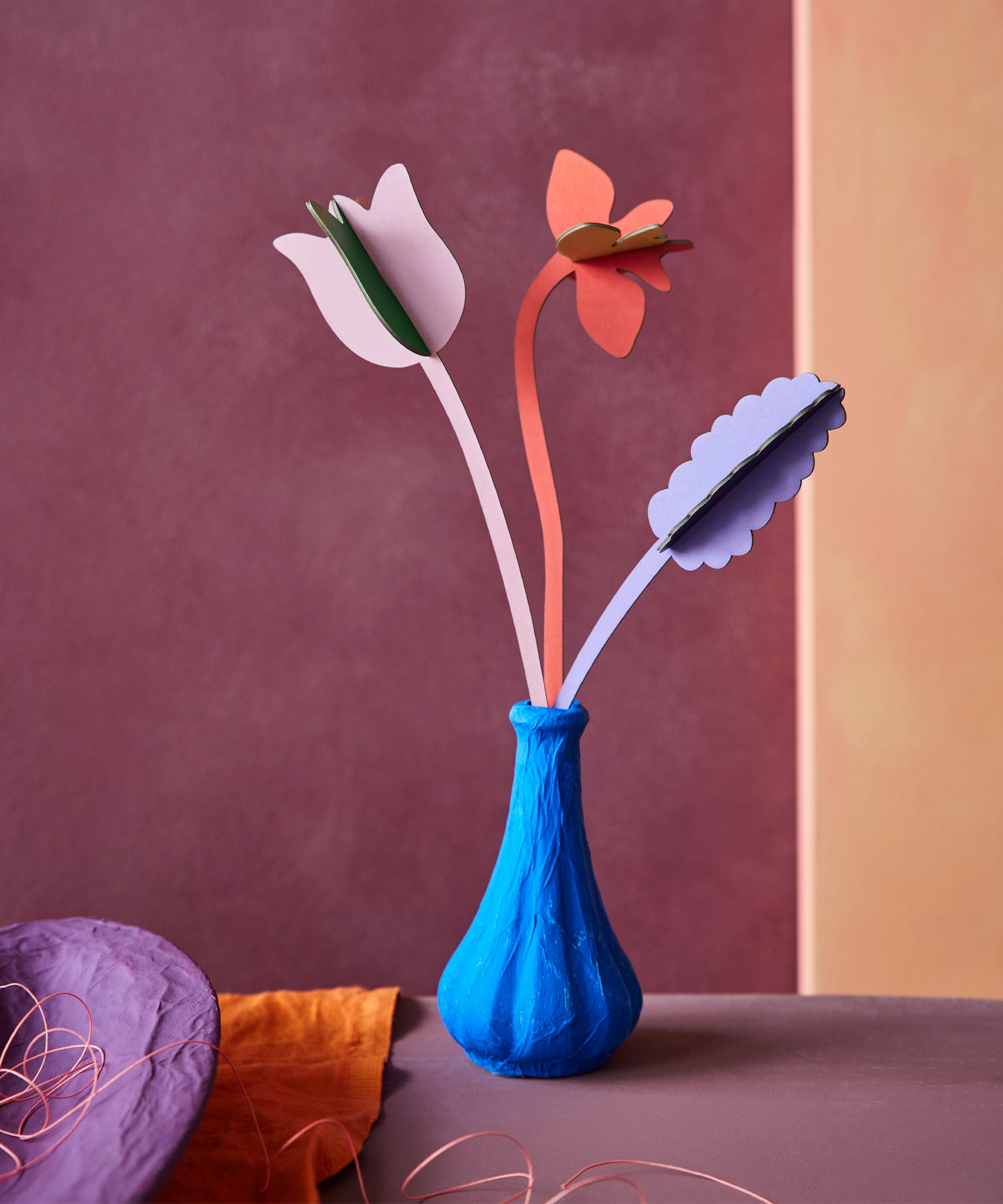 Studio Roof cardboard bouquet in Spring time surprise colour way available at Babipur. A DIY kit made from cardboard displayed in a homemade paper mache vase
