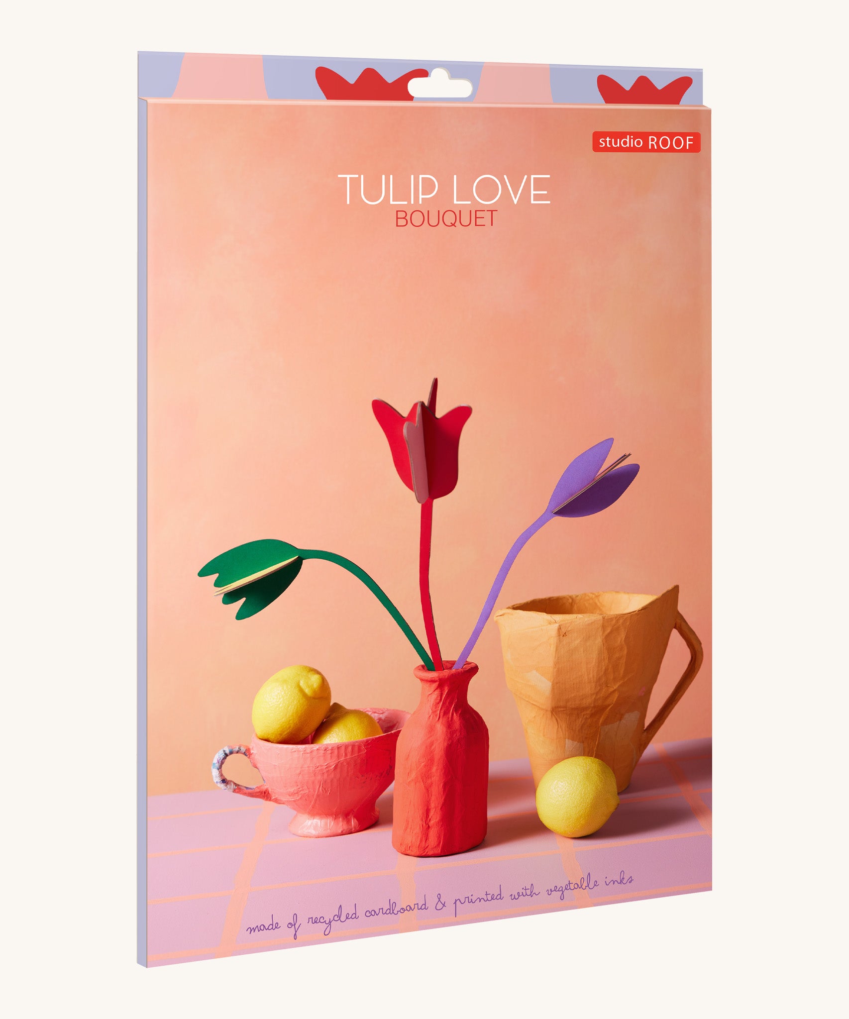 The pastel coloured cardboard packaging presenting the Studio Roof cardboard bouquet in tulip love colour way available at Babipur.