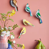 A group of Studio Roof garden birds hanging decorations on a wall available at Babipur including the brown tawny owl