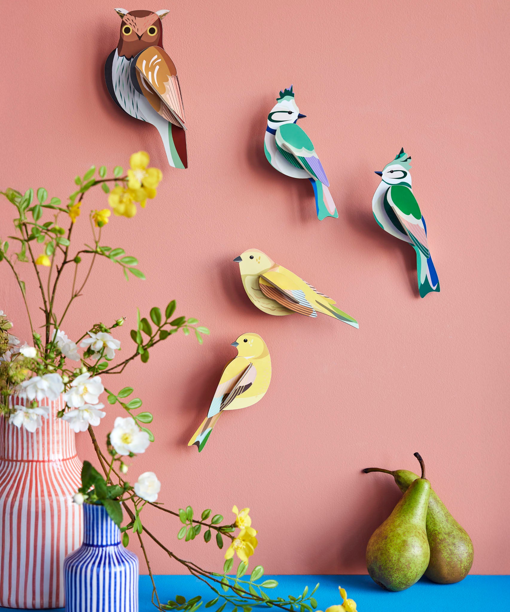 A group of Studio Roof garden birds hanging decorations on a wall available at Babipur including the brown tawny owl
