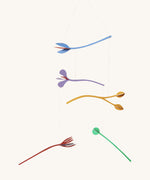 A Studio Roof cardboard Cordelia floral art mobile set available at Babipur. A multicoloured DIY cardboard floral mobile that hangs by string