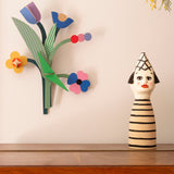 A close up of the daisy belle wall decoration available at Babipur hanging on a wall
