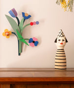 A close up of the daisy belle wall decoration available at Babipur hanging on a wall