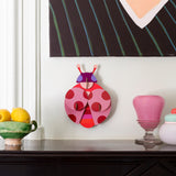 Dotted lady wall decoration available at Babipur hanging on a wall above a mantlepiece. A Studio roof collaboration with artist Zoe Miller.