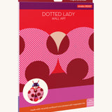 The bright and retro style cardboard packing for the dotted lady wall decoration available at Babipur