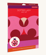 The bright and retro style cardboard packing for the dotted lady wall decoration available at Babipur