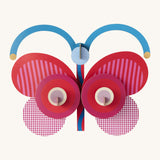 A bright and retro style stripy butterfly wall decoration available at Babipur. A Studio roof collaboration with artist Zoe Miller.