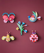 A group of wall decorations from the collaboration with Studio Roof and Zoe Miller available at Babipur.