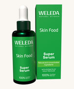 Weleda skin food super serum. A glass bottle with a pipette as a dispenser. This serum is presented in a green box with white branding on the front. Weleda have a range of luxurious, natural skin care items available at Babipur.