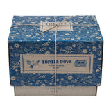 The Wooden Story Turtle Dove Rattle cardboard box, wrapped in string to make a beautiful gift, on a cream background