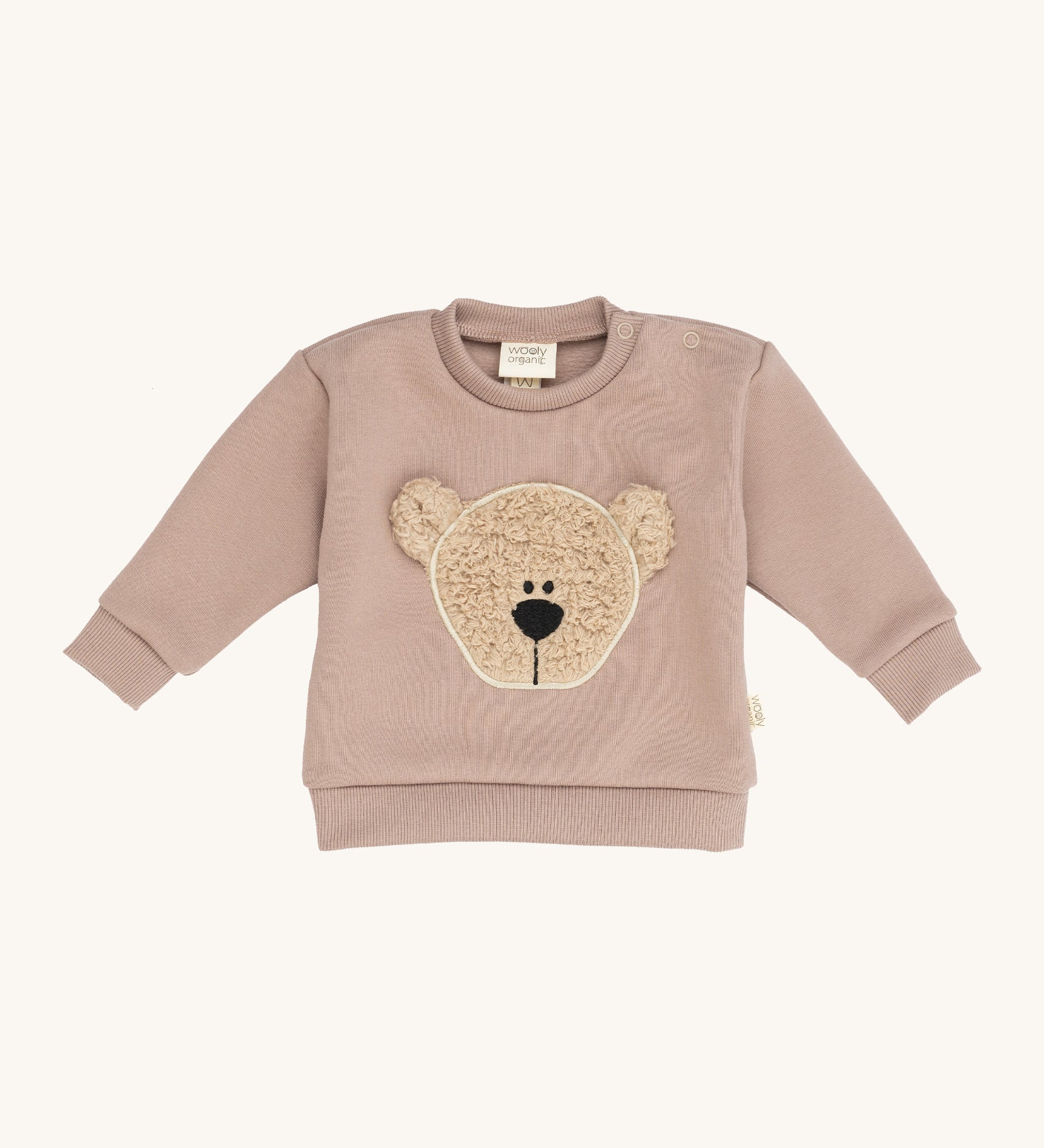 Wooly Organic embroidered sweater in pale blush pink /savannah available at Babipur. A soft GOTS organic cotton jersey sweater in light pink with a cute fluffy cream teddy bear on the front. Features popper fasteners on the shoulder for a easy fit