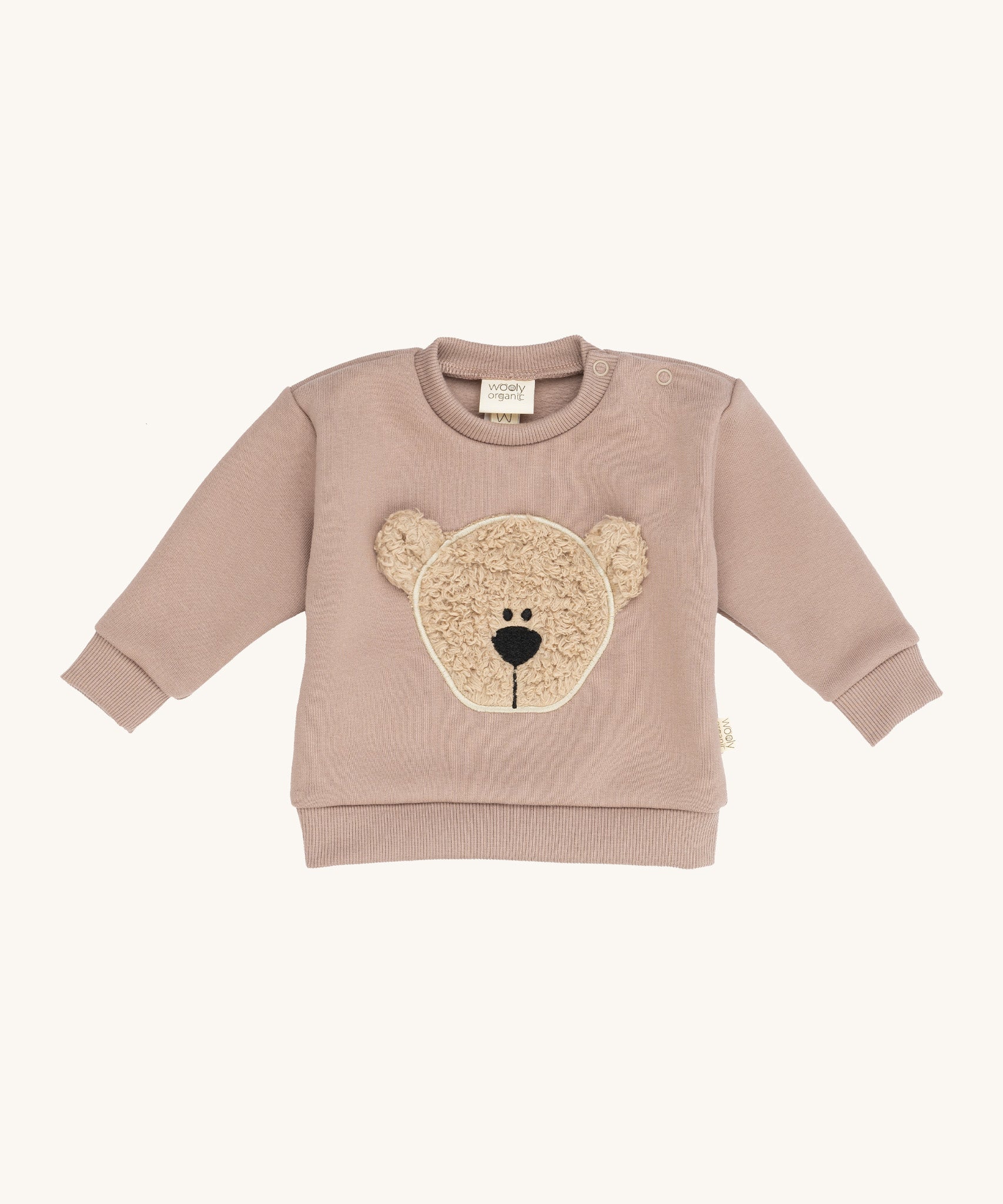 Wooly Organic embroidered sweater in pale blush pink /savannah available at Babipur. A soft GOTS organic cotton jersey sweater in light pink with a cute fluffy cream teddy bear on the front. Features popper fasteners on the shoulder for a easy fit