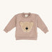 Wooly Organic embroidered sweater in pale blush pink /savannah available at Babipur. A soft GOTS organic cotton jersey sweater in light pink with a cute fluffy cream teddy bear on the front. Features popper fasteners on the shoulder for a easy fit