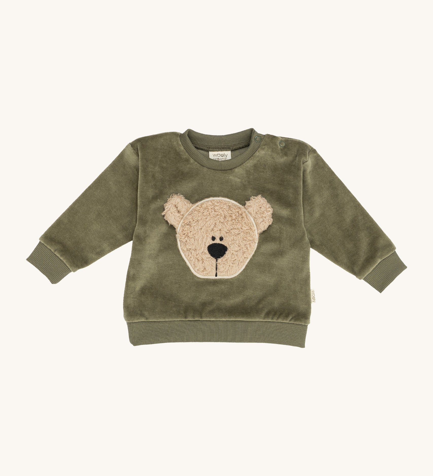 Wooly Organic embroidered sweater in tea leaf /savannah available at Babipur. A soft GOTS organic cotton jersey sweater in light green with a cute fluffy cream teddy bear on the front. Features popper fasteners on the shoulder for a easy fit