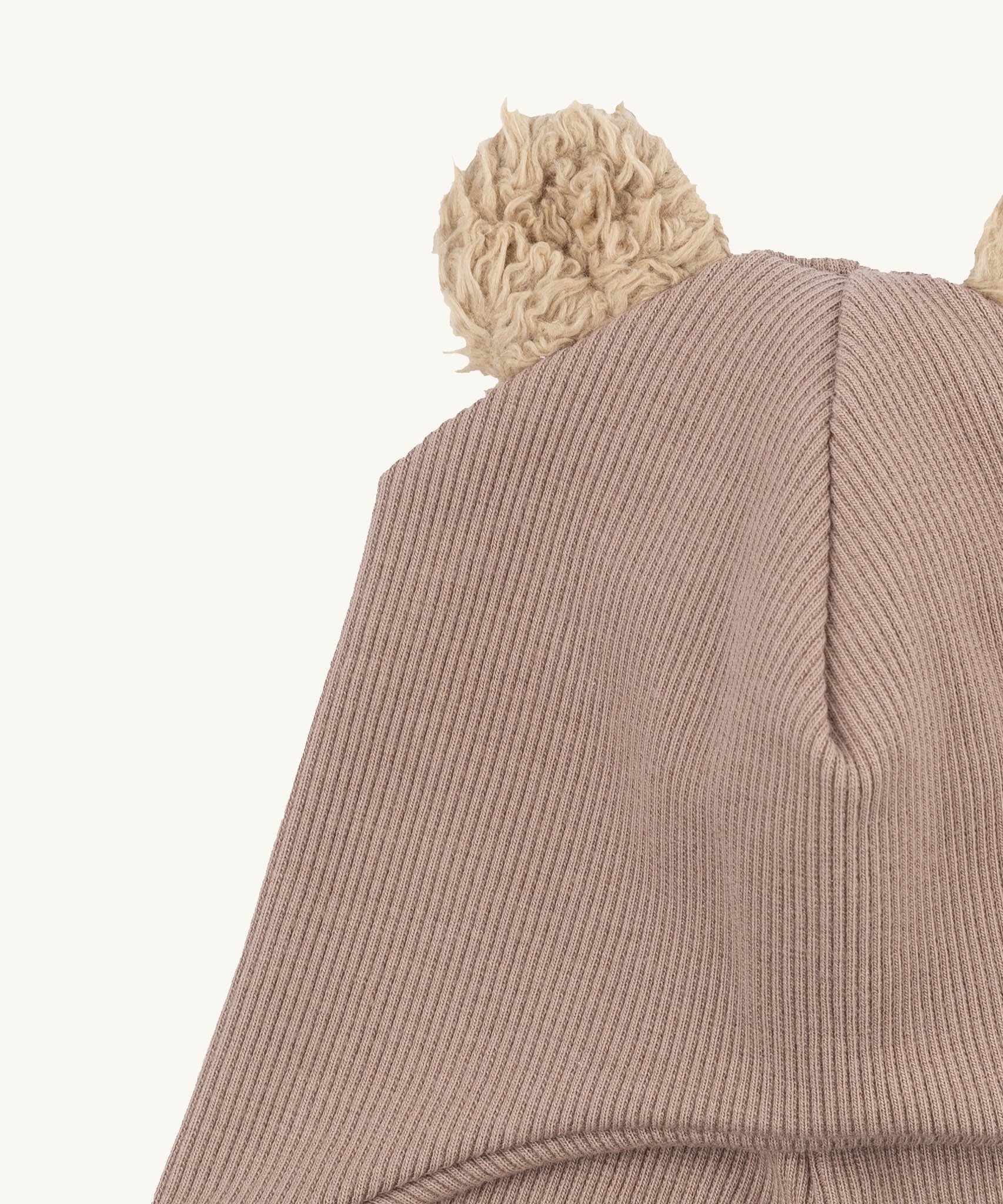 A close up of the Wooly Organic hat with teddy ears in pale blush / savannah available at Babipur showing the cute fluffy teddy bear ears detail