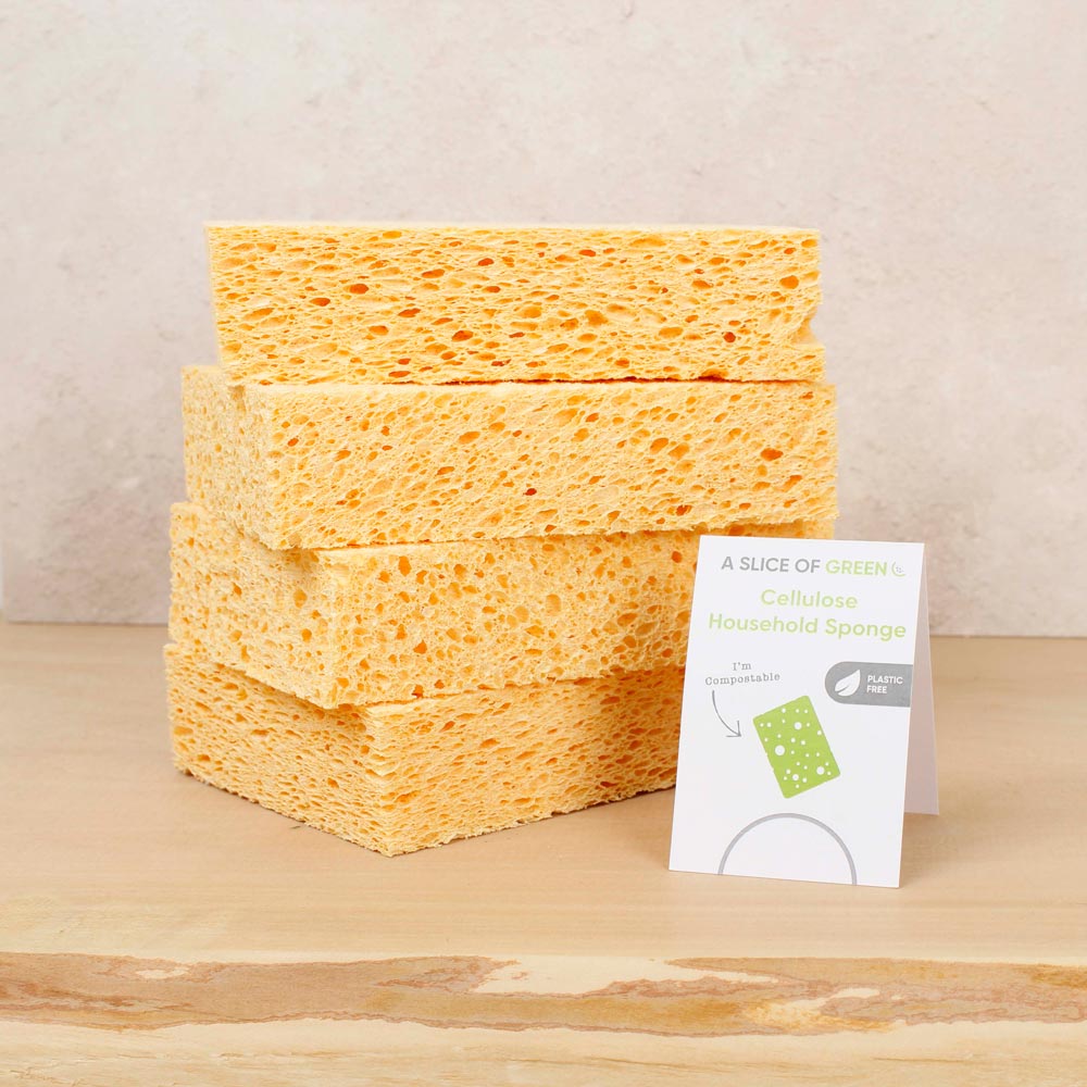 Stack of A Slice of Green natural cellulose cleaning sponges on a wooden worktop