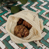 A close up of the A Slice Of Green small mesh produce bag showing the mesh detail