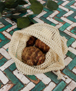 A close up of the A Slice Of Green small mesh produce bag showing the mesh detail