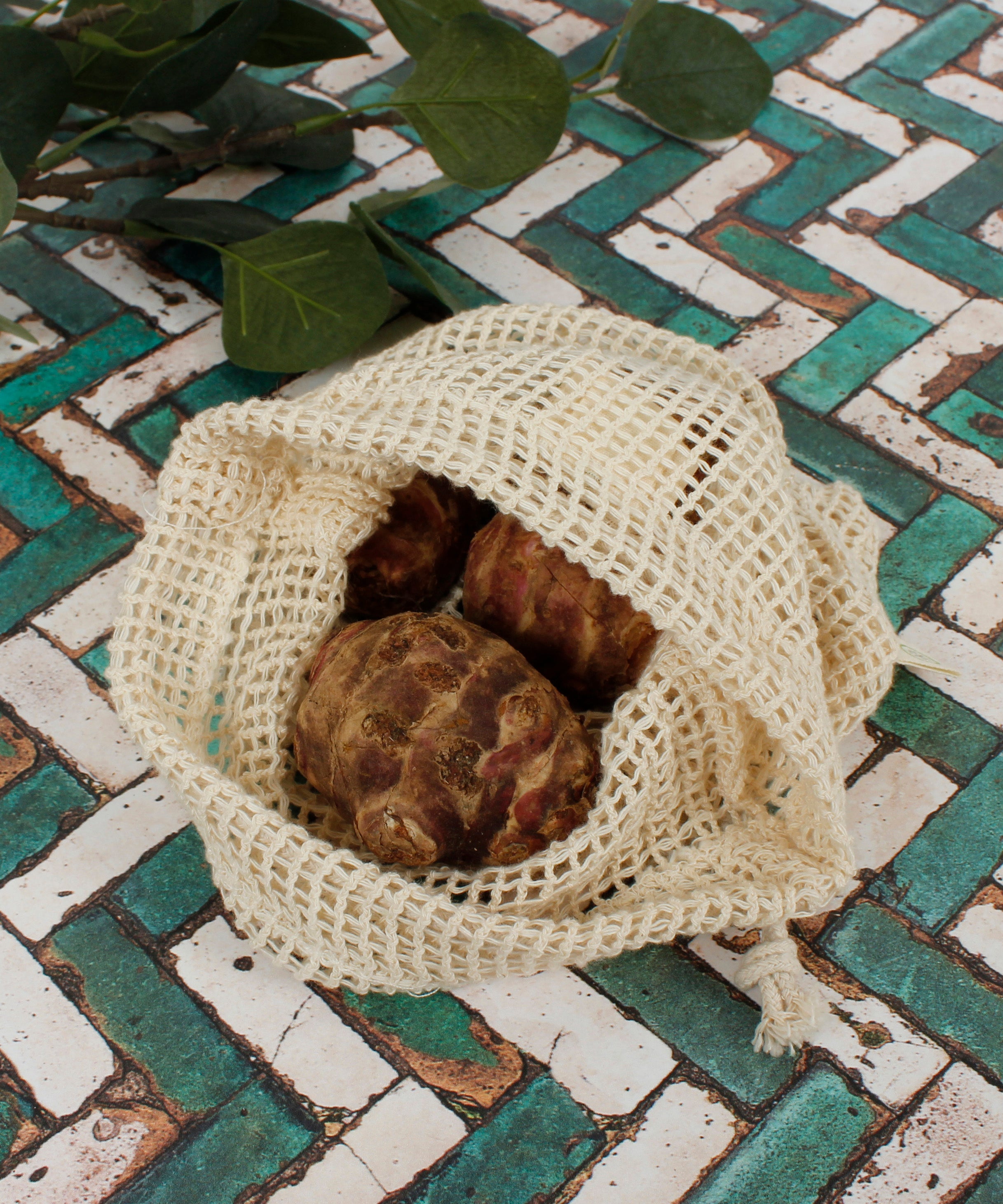 A close up of the A Slice Of Green small mesh produce bag showing the mesh detail