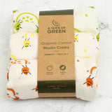 A Slice Of Green set of 3 organic cotton muslin cloths in rainbow inspired designs. Features an orange, lemon and lime print on each cloth.