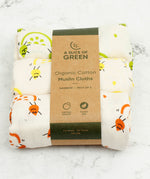 A Slice Of Green set of 3 organic cotton muslin cloths in rainbow inspired designs. Features an orange, lemon and lime print on each cloth.