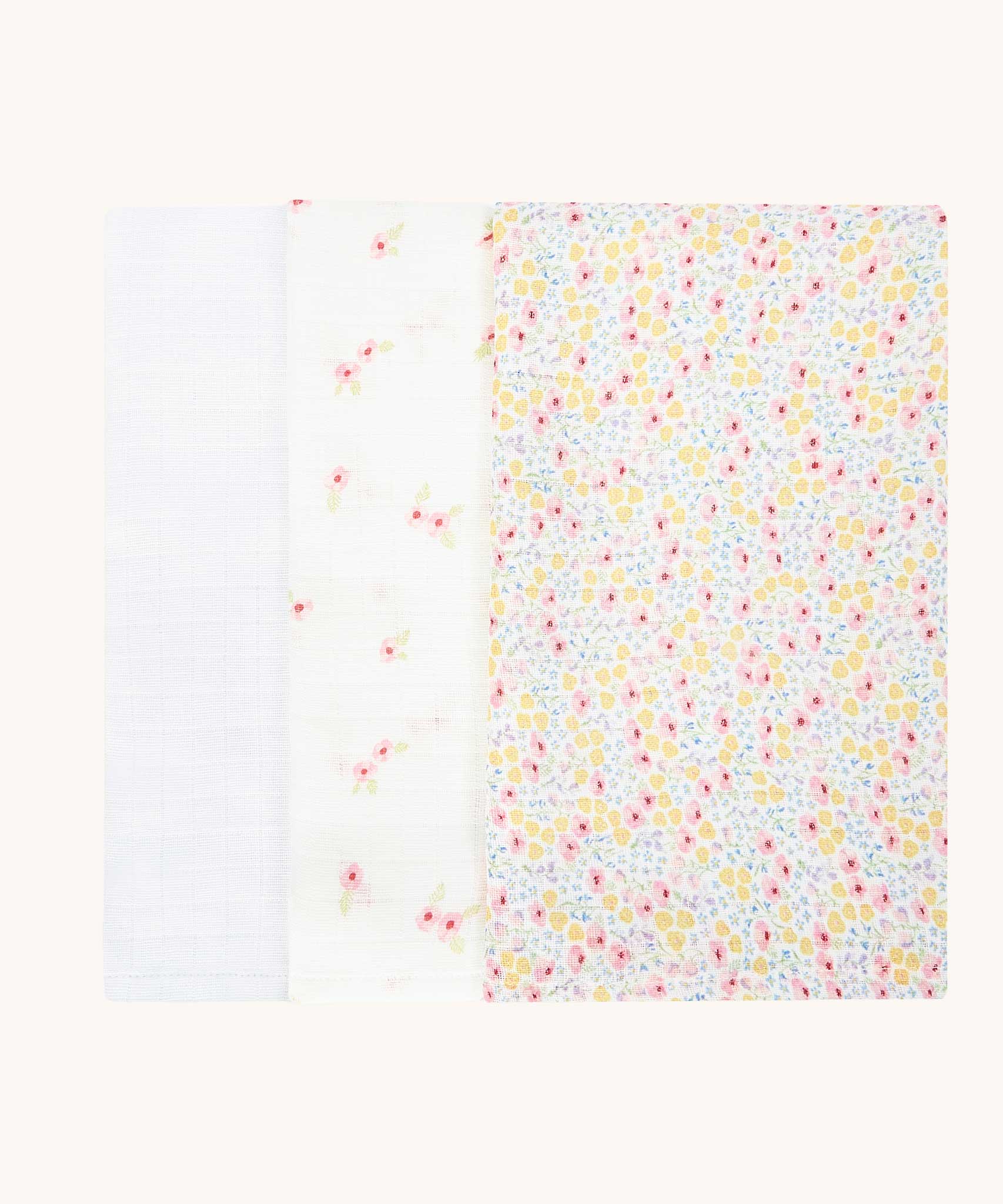Avery Row Wildflower Baby Muslin Squares in a Set of 3. One cloth is plain white, one has delicate pink flowers and one has an all over floral wildflower design. Avery Row have a collection of stylish nursery and baby essentials available at Babipur.