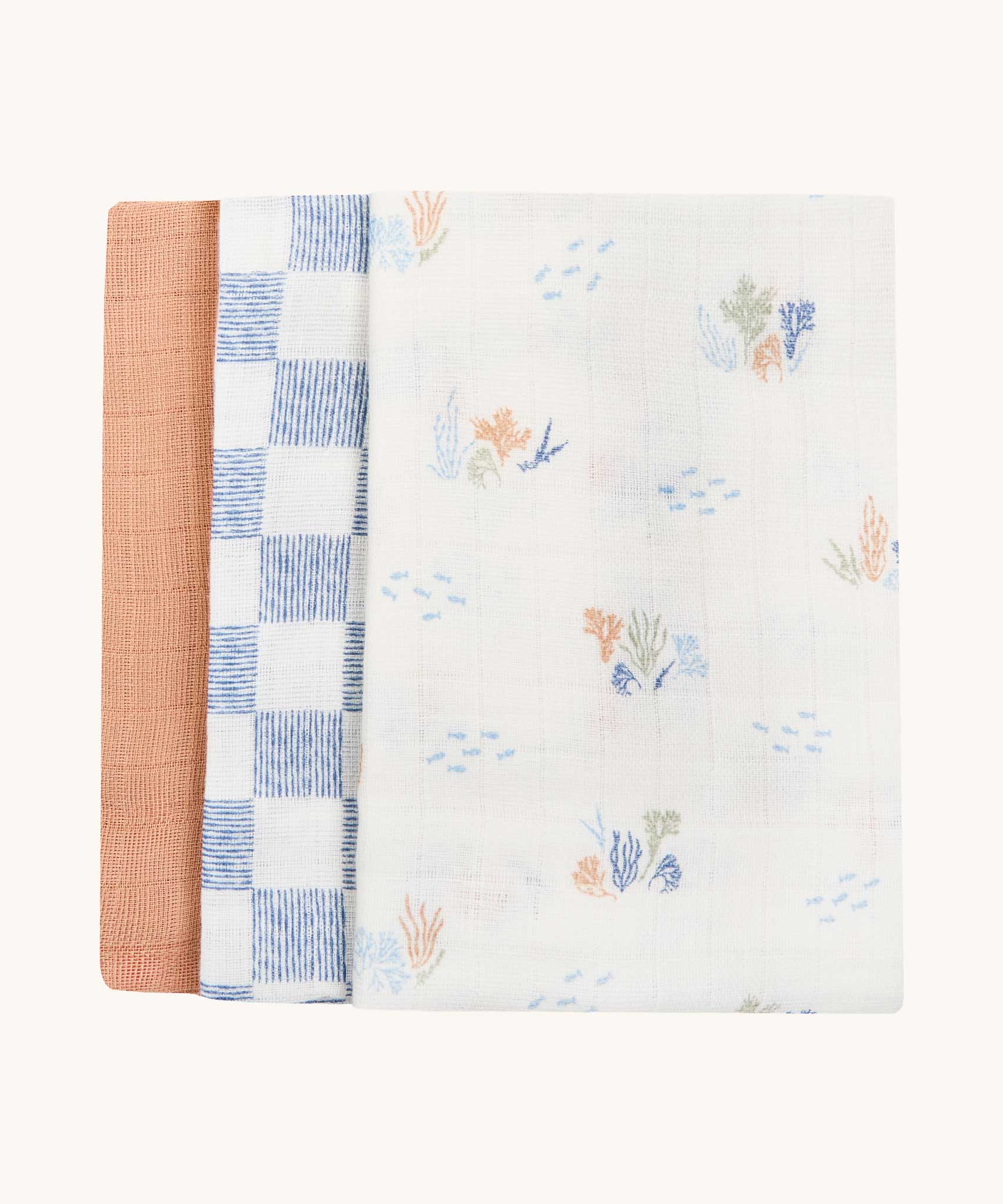Avery Row Coastline Baby Muslin Squares in a Set of 3. The pack has one plain coral coloured cloth, one check blue and white waves design and one coastline print design. Avery Row have a range of stylish baby and nursery essential available here at babipur.