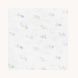 Avery Row Coastline baby Muslin Swaddle. The swaddle features a delicate coastline print that has corals and little blue fish. Avery Row have a collection of stylish nursery and baby essentials available at Babipur.